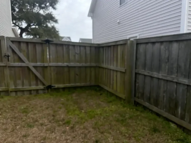 dirty fence before power washing - hampstead nc, surf city nc, and holly ridge nc